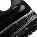 Highlighting the Sculpted Lightweight Foam Midsole Texture, Moulded Synthetic Leather Swoosh Detailing, and Multi-Directional Rubber Tread, demonstrating the impact-absorbing foam depth and retro-tested tooling.