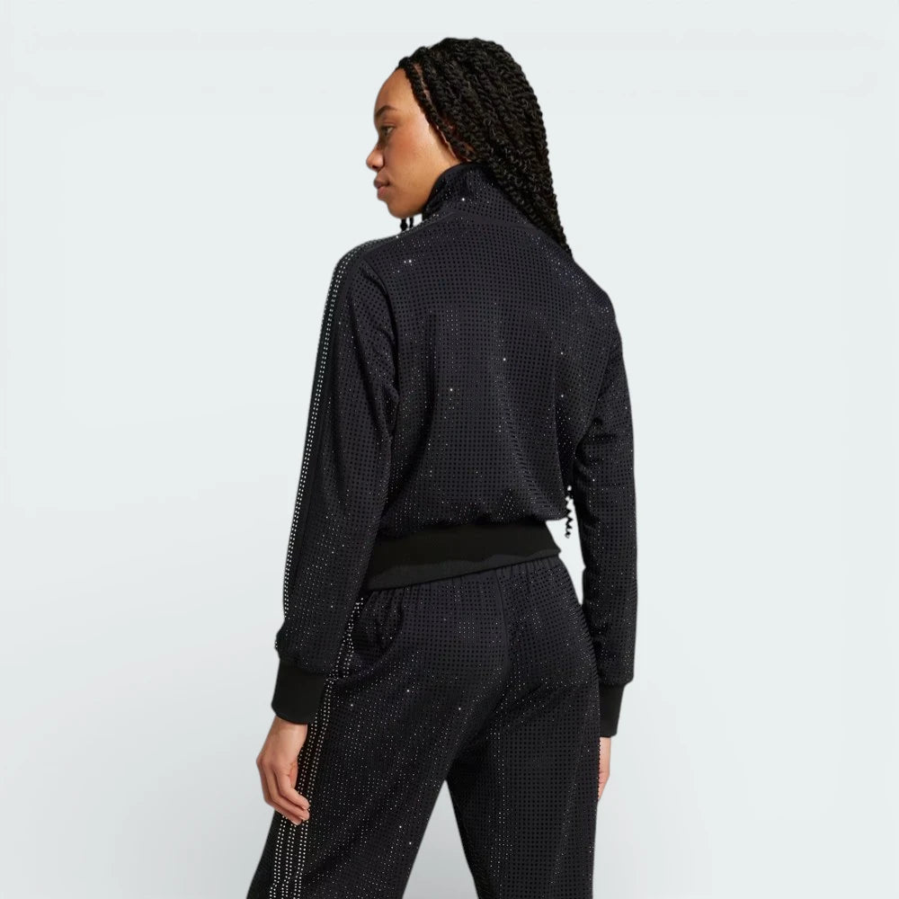 Rear view of the track jacket, showcasing the clean, minimalist back and the continuous 3-Stripes design on the shoulders.