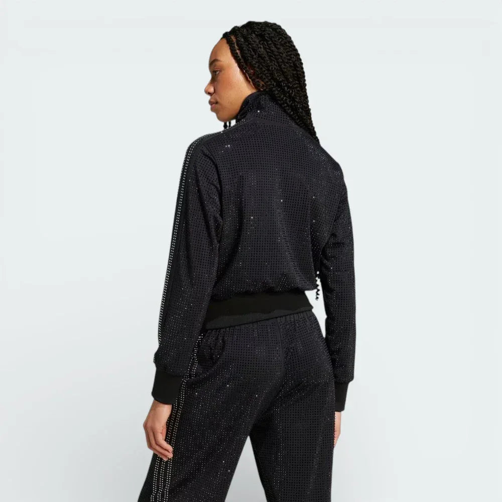 Rear view of the track jacket, showcasing the clean, minimalist back and the continuous 3-Stripes design on the shoulders.