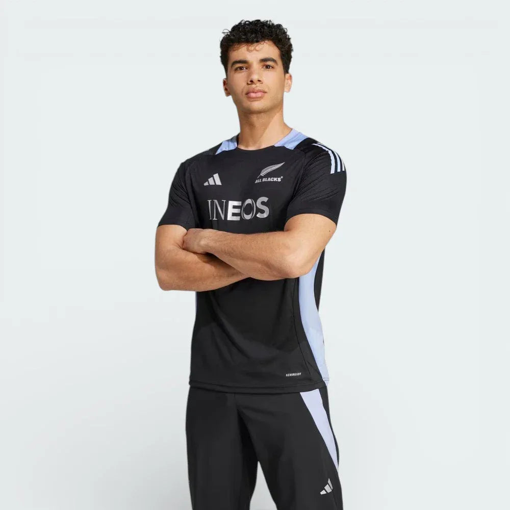 Front profile of the black All Blacks training tee, showing the athletic slim fit and the tonal black-on-black adidas branding.