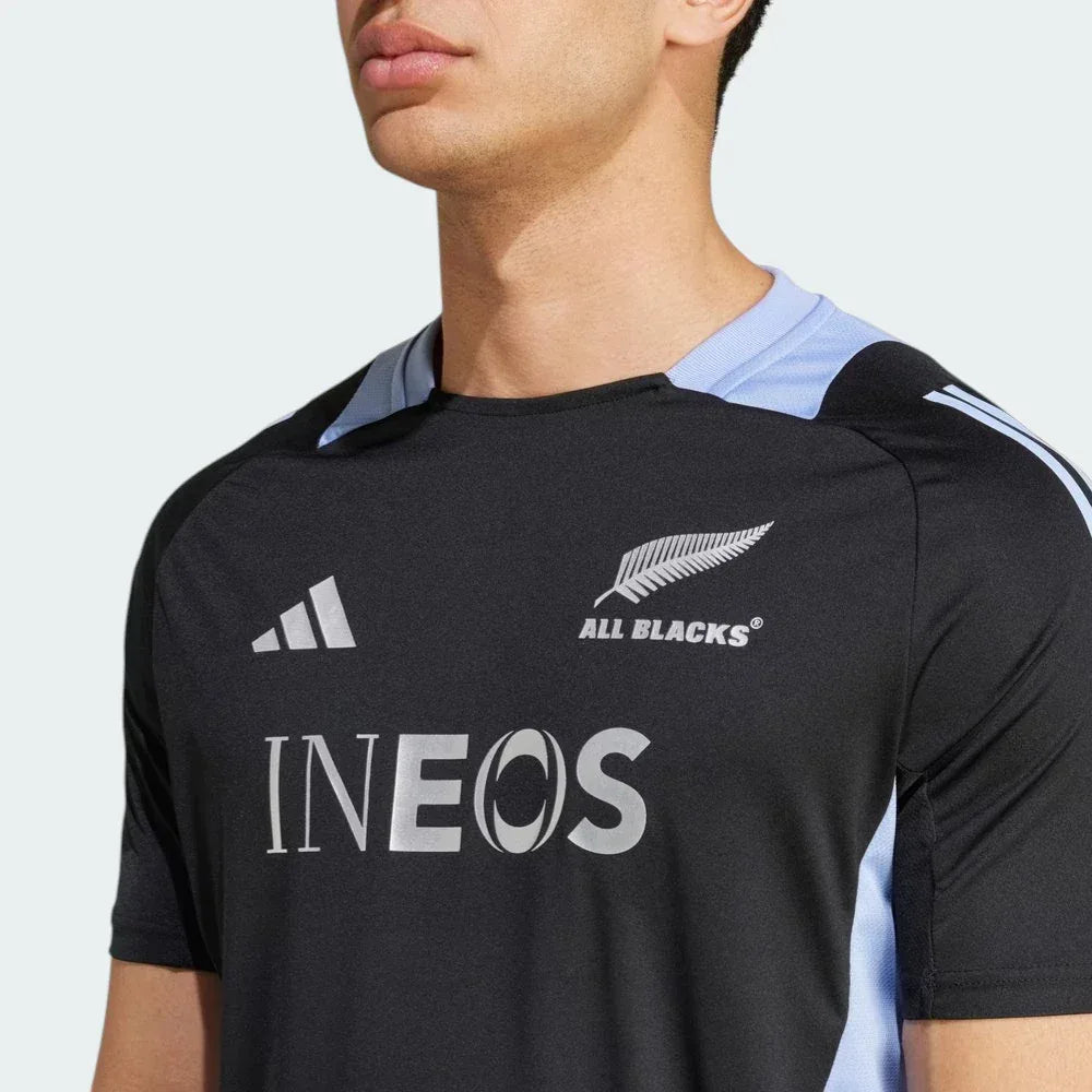 Close-up of the chest area, focusing on the high-definition Silver Fern All Blacks crest and the textured AEROREADY fabric.