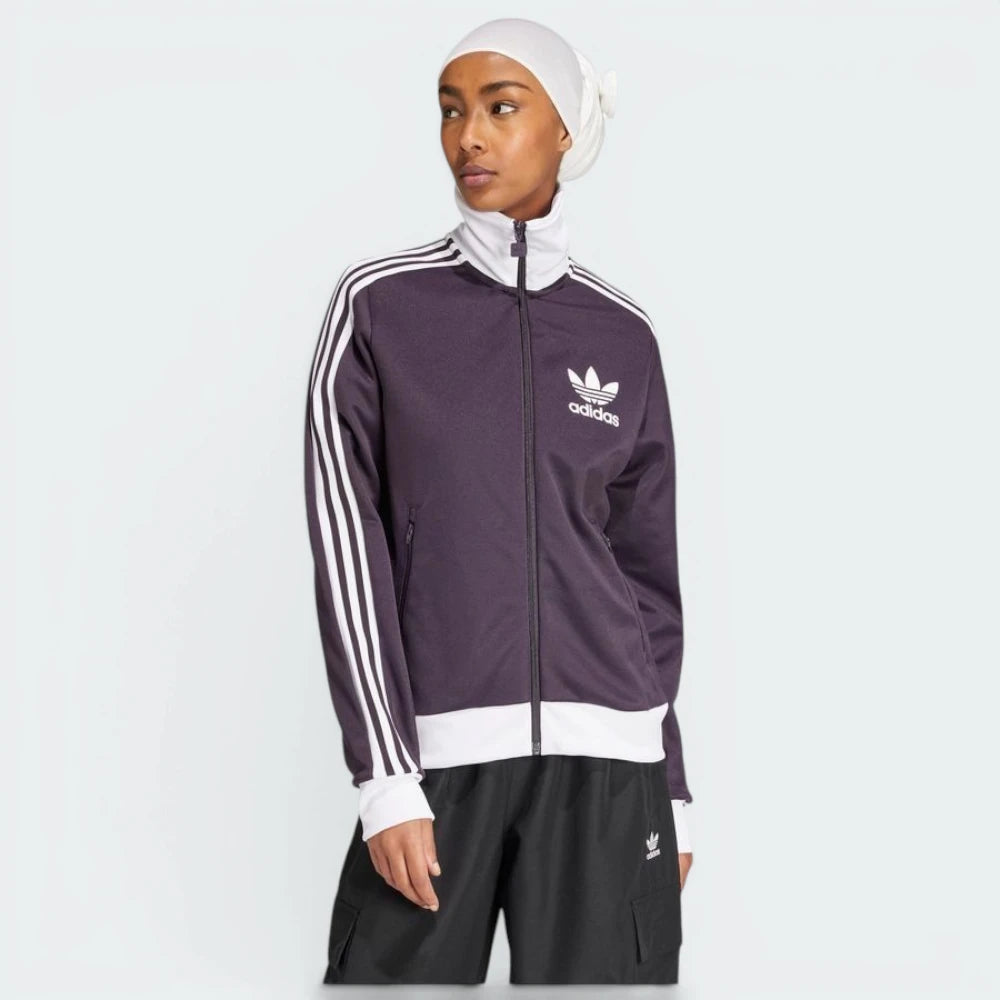 Highlights the high-velocity white 3-Stripes and the professional depth of the Aurora Black fabric.