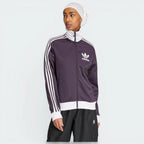 Highlights the high-velocity white 3-Stripes and the professional depth of the Aurora Black fabric.