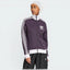 Highlights the high-velocity white 3-Stripes and the professional depth of the Aurora Black fabric.