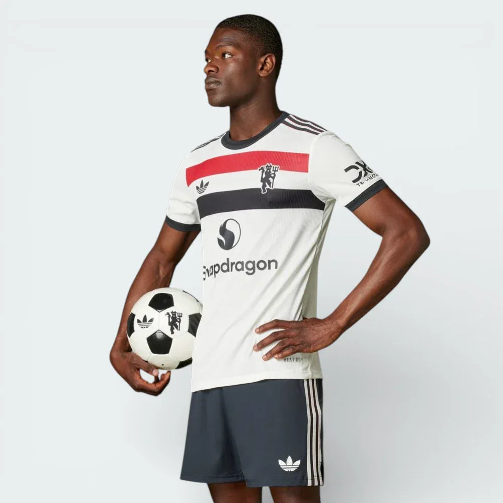 Main profile of the Off White Manchester United authentic jersey, showing the slim-fit athletic cut and the tricolour sleeve detailing. Main image