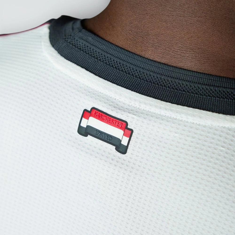 Detailed zoom of the rear crew neck and Manchester United branding