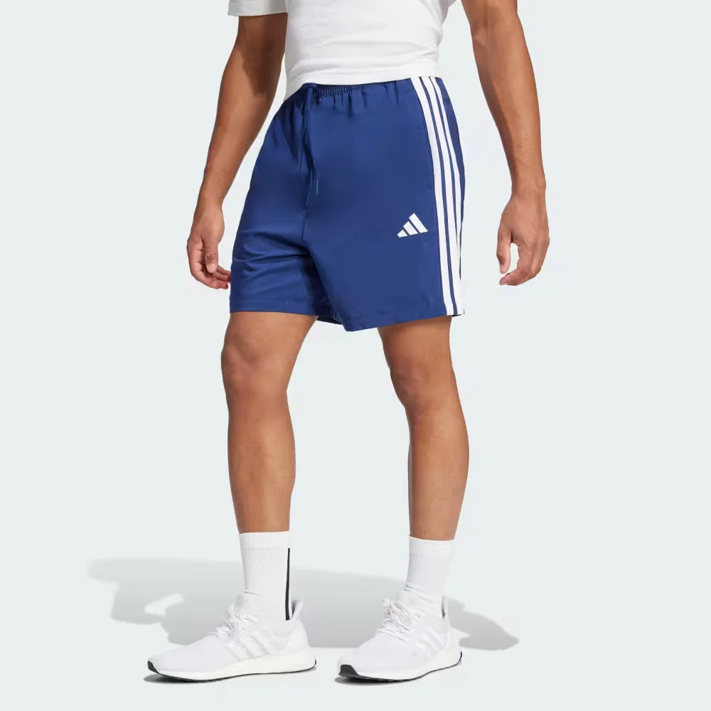 The Dark Blue Chelsea shorts, highlighting the high-contrast white 3-Stripes and the clean athletic hem.