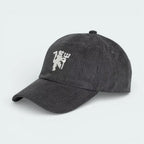 Side profile of the black corduroy Manchester United cap, showing the textured ribbed fabric and the classic curved brim.