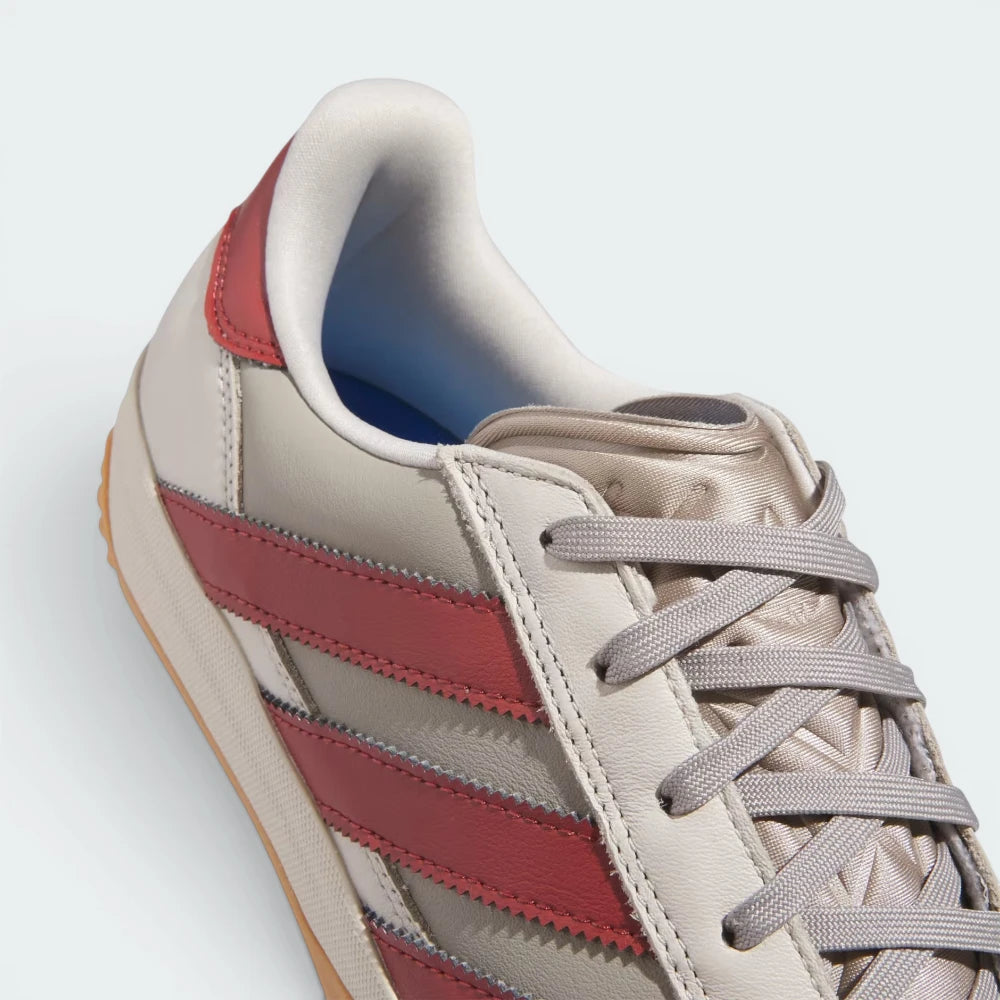Highlights the "unreal" textured finish of the gum rubber sidewalls where they bond securely to the premium cowhide upper.