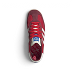 Focuses on the locked-in lace configuration, the high-definition dimpled textures of the retro tongue, and the symmetry of the suede toe guards.