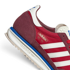Highlights the "unreal" clean finish where the serrated rubber outsole anchors to the dual-density blue and white cushioning foam.