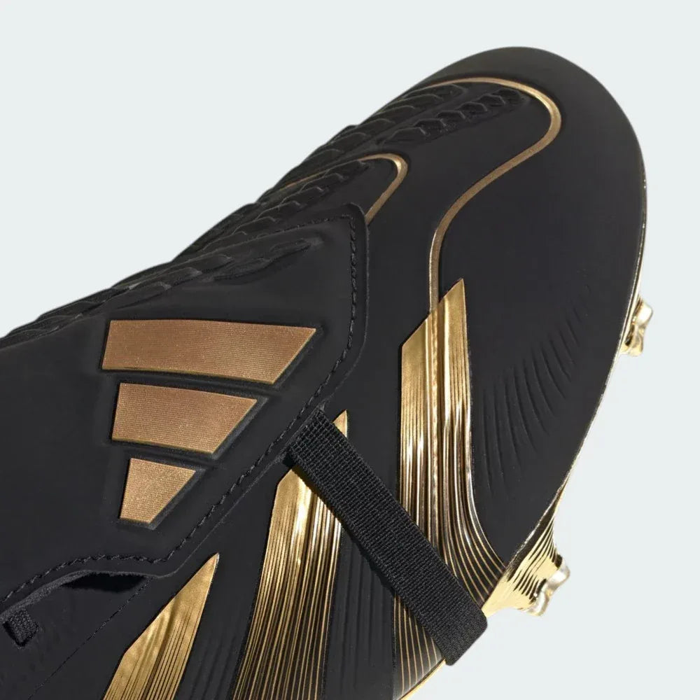 Close-up of the fold-over tongue and the Strikeskin rubber fins, showcasing the precision-engineered texture for ball control.