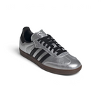 Emphasising the low-profile casual silhouette and the professional contrast of the dark black heel tabs against the reflective silver body.