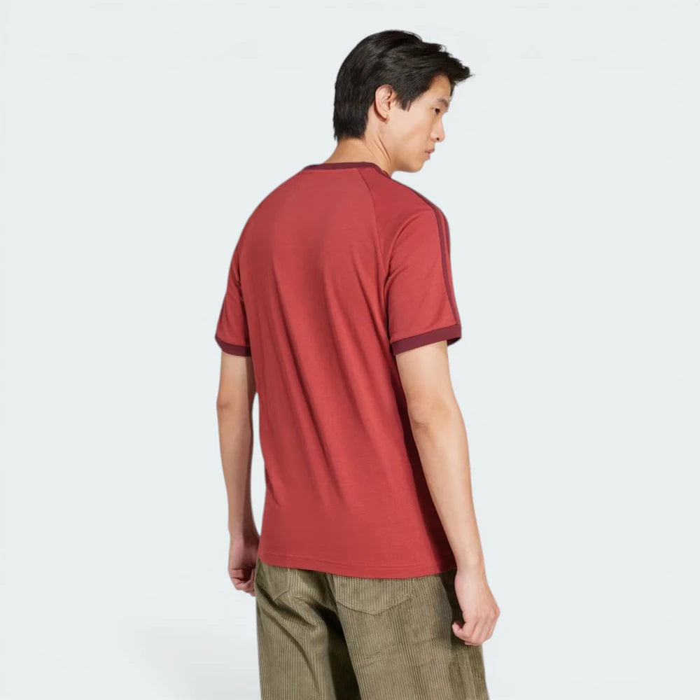 Rear view of the t-shirt, showing the clean, solid ruby finish and the structured stitching across the shoulders.