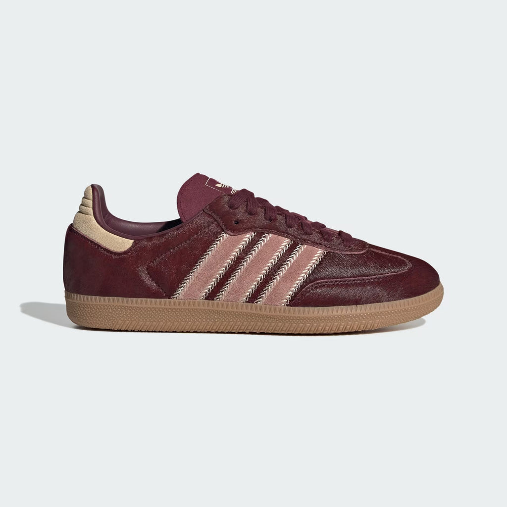 Highlights the high-velocity, hand-crafted look of the Maroon 3-Stripes and the professional, tactile depth of the Sand Strata pony hair texture across the upper.