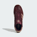 Focuses on the tidy lace closure, the clean alignment of the T-shaped toe box, and the matching earth-toned branded footbeds.