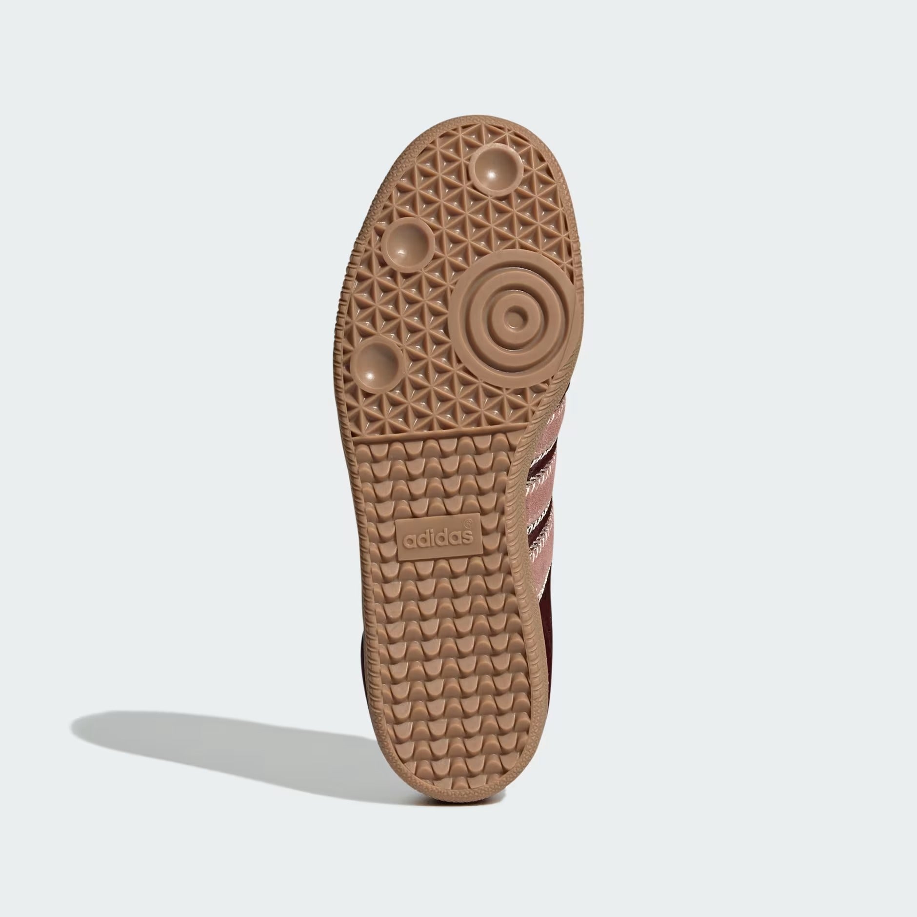 Displays the technical flat-grippy pivot-point traction pattern of the gum rubber outsole, engineered for unreal everyday street grip.