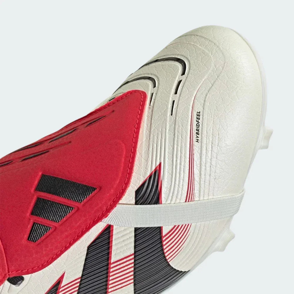 Close-up of the fold-over tongue and the Strikeskin rubber fins, showcasing the precision-engineered texture for ball control.