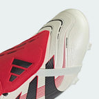 Close-up of the fold-over tongue and the Strikeskin rubber fins, showcasing the precision-engineered texture for ball control.