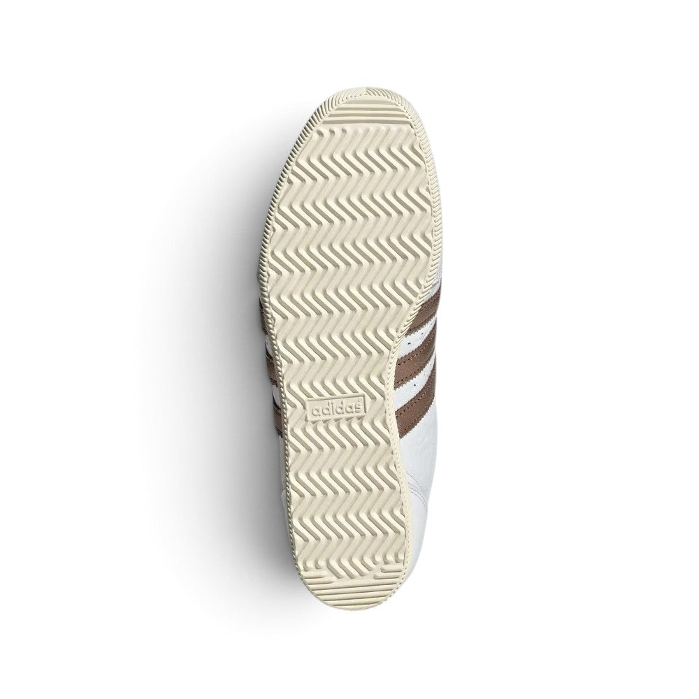 Displays the full-length low-profile rubber sole, showcasing the vintage traction grip pattern and debossed adidas Trefoil logo.