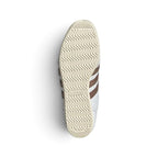 Displays the full-length low-profile rubber sole, showcasing the vintage traction grip pattern and debossed adidas Trefoil logo.
