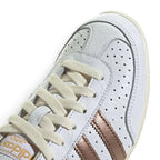 Details the micro-precision of the forefoot area, showing the smooth Cloud White leather, double-stitched toe overlay, metallic lace eyelet accents, and crisp laces.