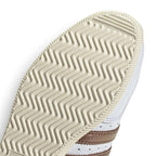 Highlights the "unreal" clean finish where the low-profile cream rubber sole meets the finely stitched Cloud White leather upper boundary.