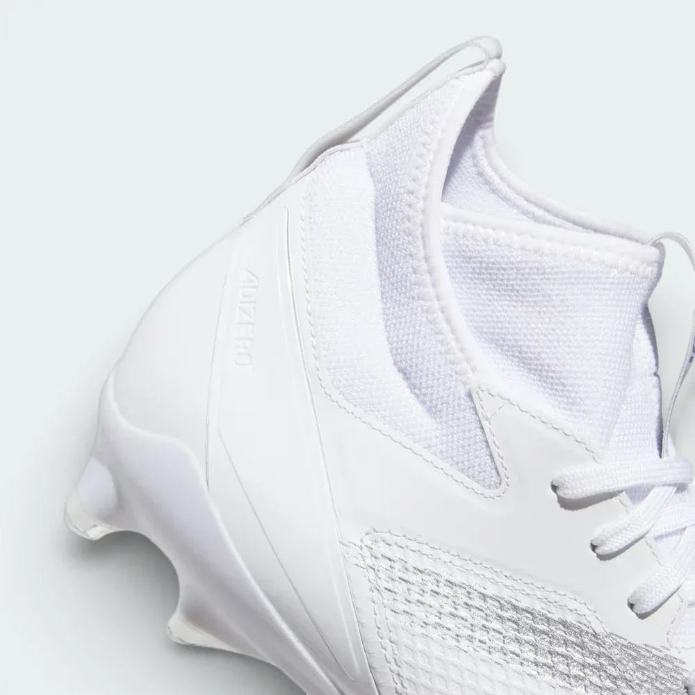 Detailed zoom on the REPETITOR midsole and the cleat plate, highlighting the cushioning technology and durable stud construction.