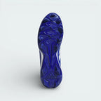 View of the molded outsole, showcasing the specialized stud configuration designed for grip and propulsion on the turf.