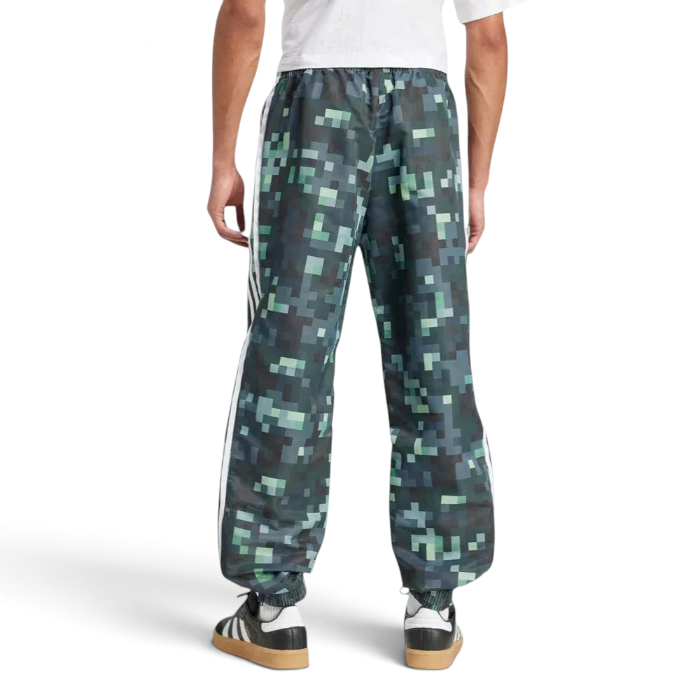 Rear view of the track pants, highlighting the clean finish of the Legend Ivy green and the structured fit.