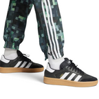 Close-up of the ankles showing the zip fasten and cuffed hem