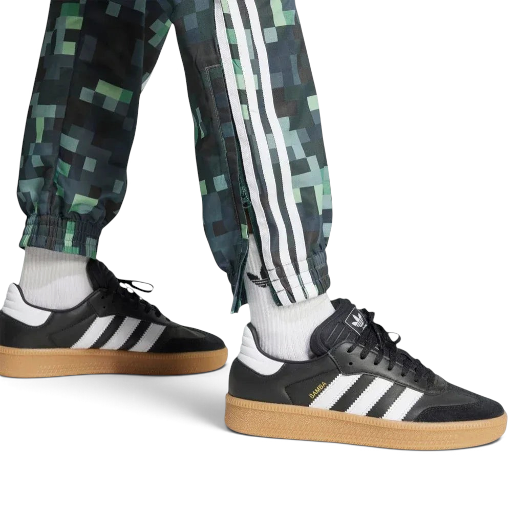 Close-up of the ankles showing the zip fasten and cuffed hem