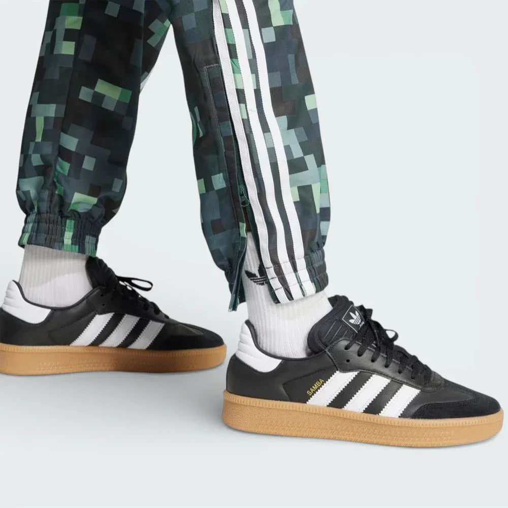 Close-up of the ankles showing the zip fasten and cuffed hem