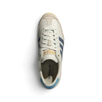 Focuses on the locked-in central lacing layout, displaying off-white laces, perforated leather tongue tabs printed with Trefoil branding, soft textile collars, and insoles stamped with adidas Japan logos.