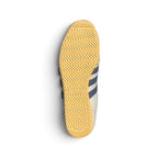 Displays the full-length low-profile rubber sole, showcasing the vintage traction grip pattern and debossed adidas Trefoil logo.