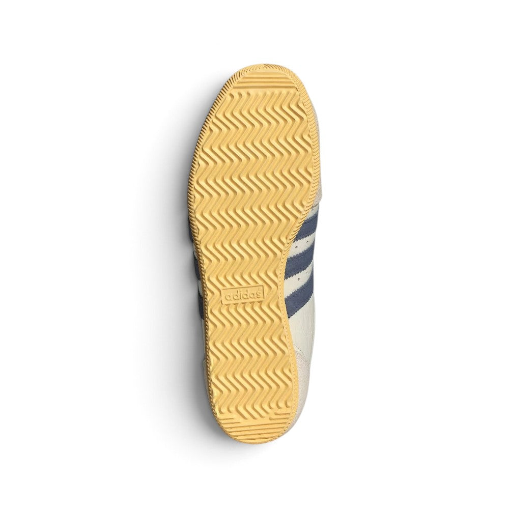 Displays the full-length low-profile rubber sole, showcasing the vintage traction grip pattern and debossed adidas Trefoil logo.