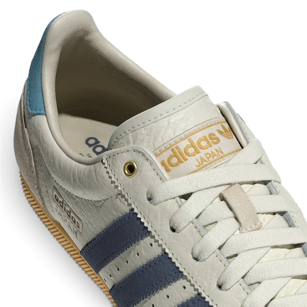 Details the micro-precision of the forefoot area, showing the textured tumbled leather perforations, double-stitched T-toe overlay, and crisp off-white laces.