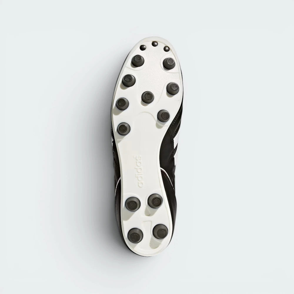 Displays the traditional rounded layout of the permanent polyurethane firm-ground studs, engineered for unreal linear acceleration and mud shedding.