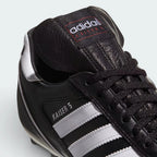 Details the premium dual-stitching lines crossing the leather toe cap control zone and the precision lacing configuration eyelets.