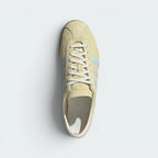 Focuses on the clean lace closure, the high-definition texture of the Almost Yellow suede tongue, and the matching branded footbeds.