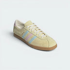 Emphasising the classic low-top profile and the professional, eye-catching alignment of the tricolour stripes.