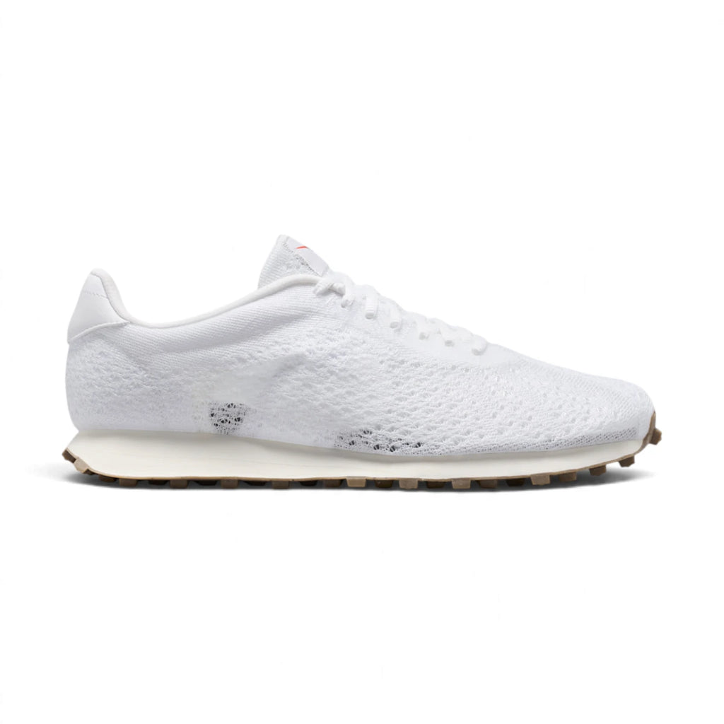 Side profile of the Nike LD-1000 Flyknit Men's Shoe in White and Sail showing Flyknit upper, synthetic leather overlays, sail midsole, and brown waffle outsole.