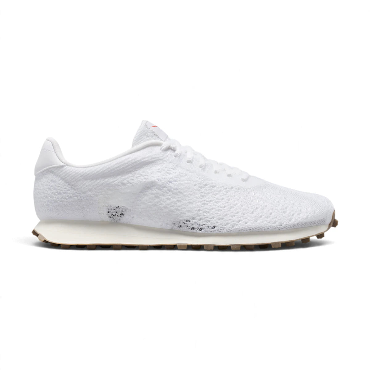 Side profile of the Nike LD-1000 Flyknit Men's Shoe in White and Sail showing Flyknit upper, synthetic leather overlays, sail midsole, and brown waffle outsole.