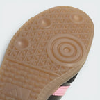 Close-up of a shoe sole with a textured pattern on a light gray background