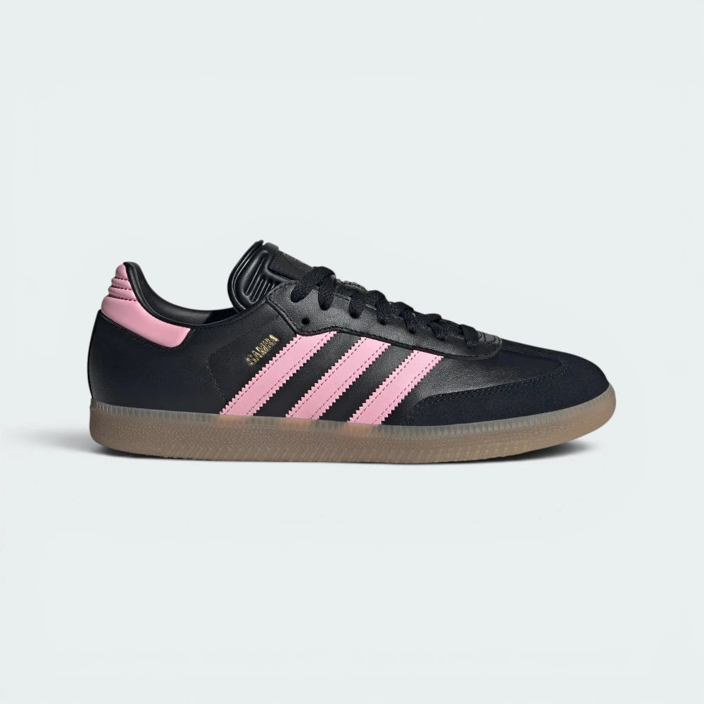 Highlights the high-velocity sweep of the black side branding, showing the professional, deep leather textures and the clean pop of the soft pink heel counter. Main image
