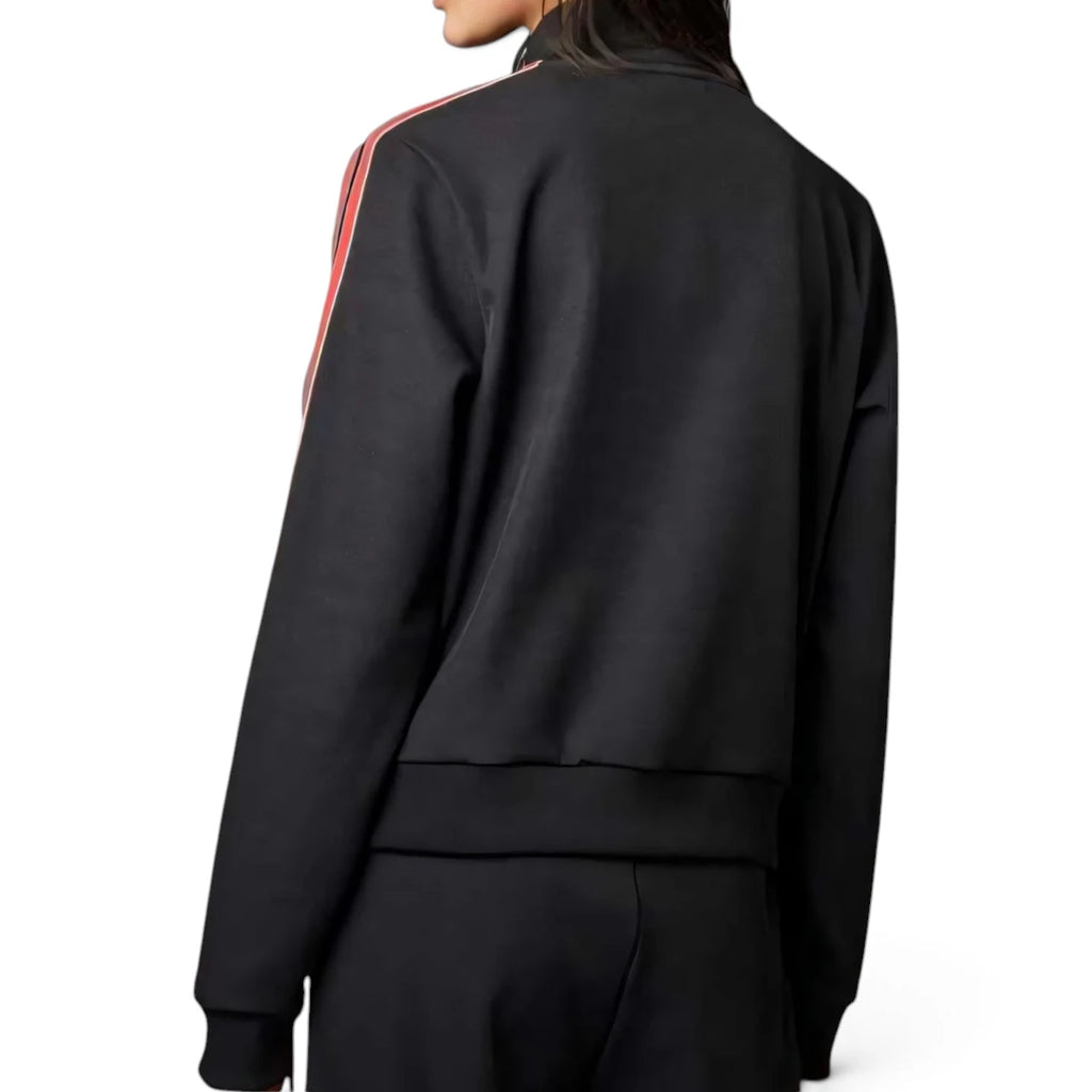 Lifestyle rear perspective showing the fit across the shoulders and back during movement.