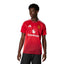 Studio lifestyle view of a model wearing the Manchester United 24/25 home jersey in Mufc Red, highlighting the classic crewneck, white Snapdragon sponsor logo, embroidered club crest, and bright red side inserts.