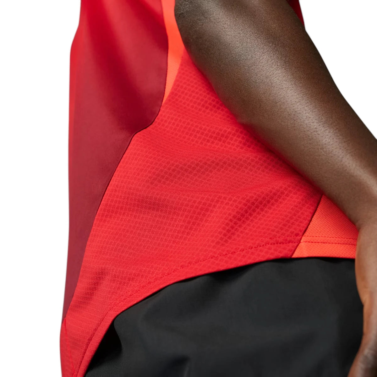 Detailed close-up angle focusing on the breathable red mesh side panels designed to enhance airflow and cooling.