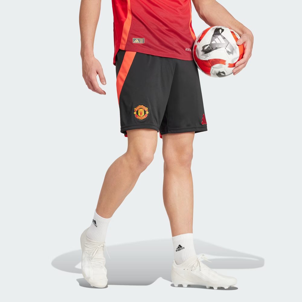 The Black Man Utd shorts, highlighting the bright red Adidas 3-Stripes and the embroidered club crest.