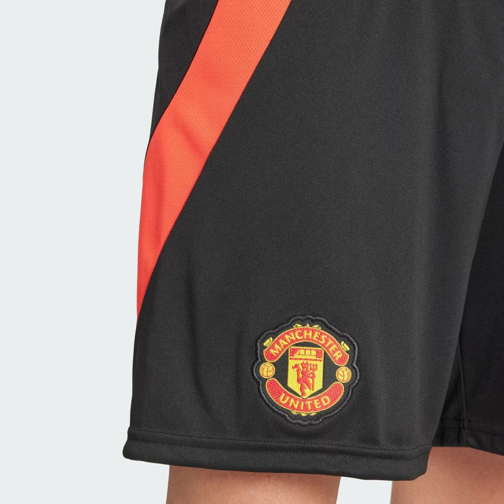 A close-up of the high-density embroidery of the Manchester United badge.